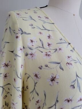 H&M dress, pastel yellow with pink flowers, flowy fabric, button down front